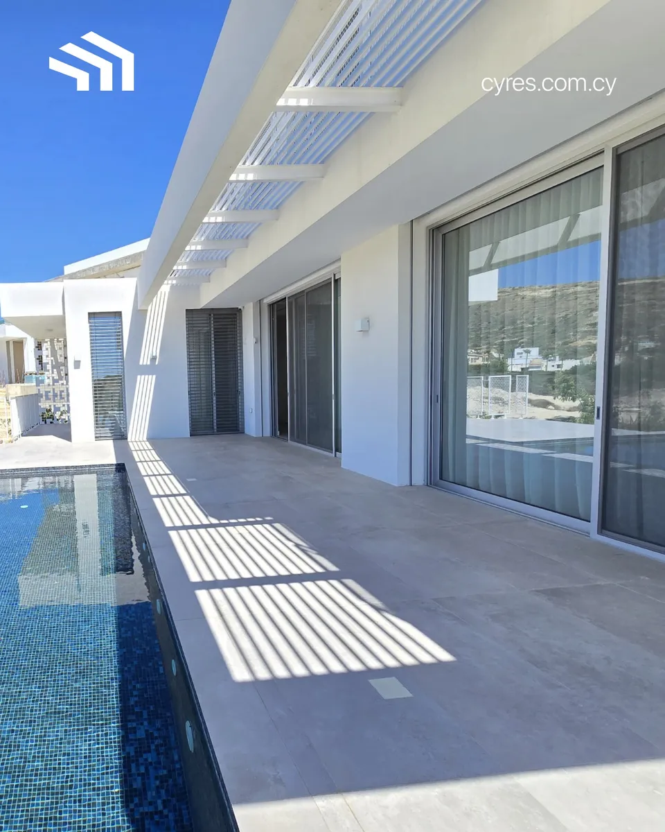 Completed, and ready to be lived in.
Light moves across the terrace. Sheer curtains soften the afternoon. A long island 